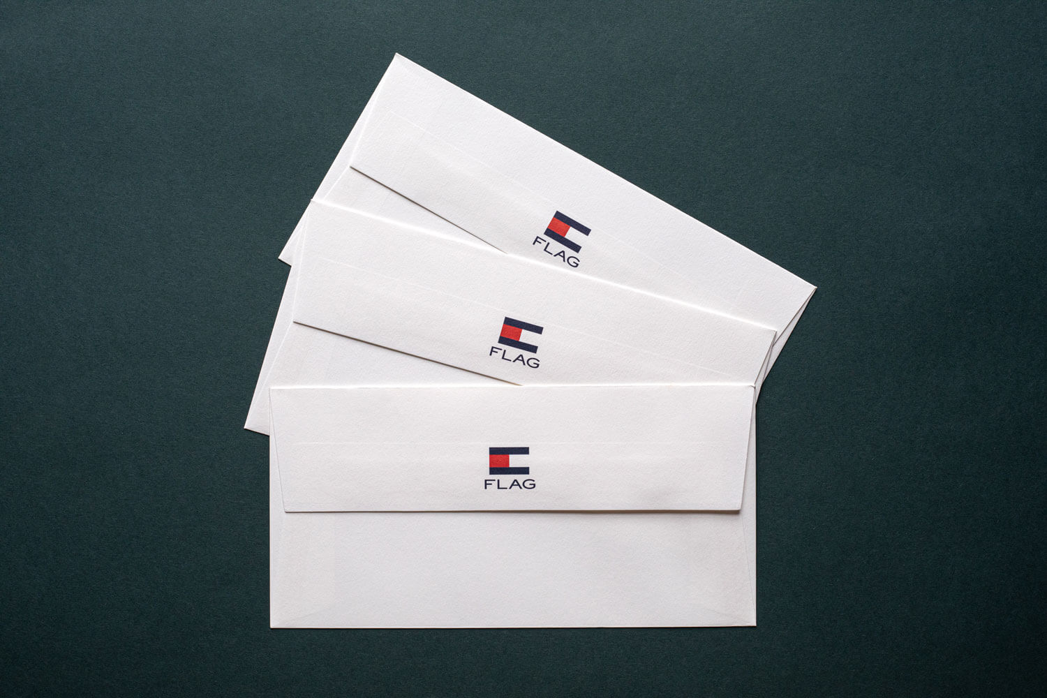 premium white envelopes with a corporate logo printed in red and blue