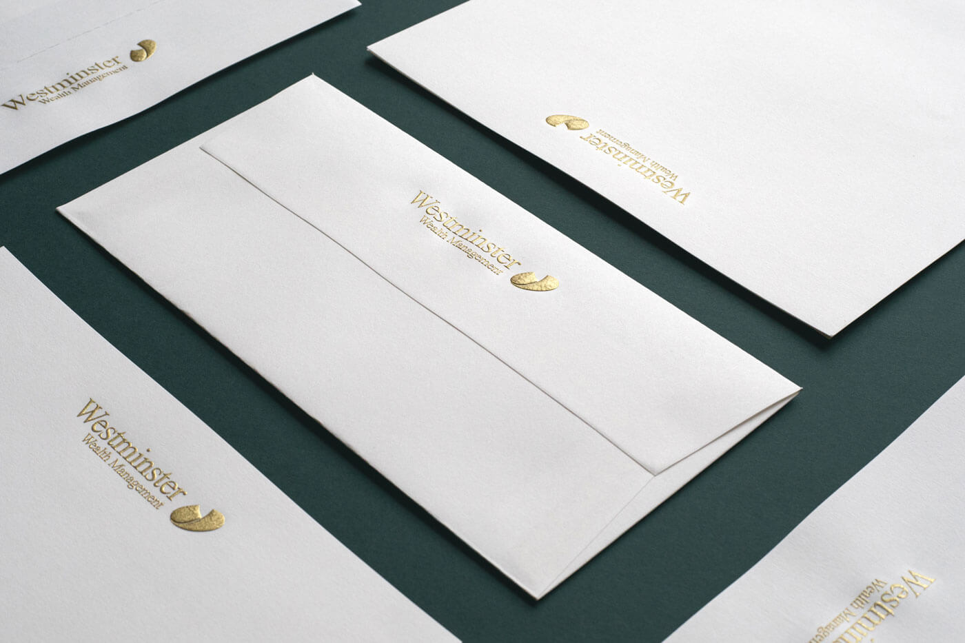 gold engraved logo on white envelopes
