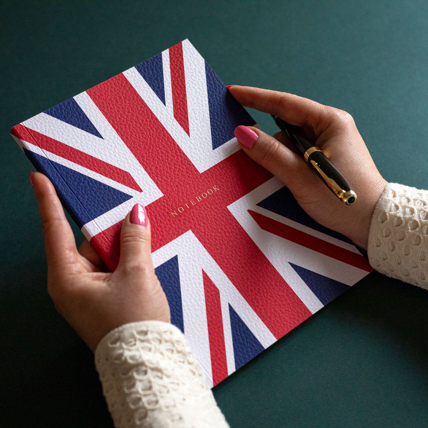 hands holding union jack notebook printed leather look textured paper gold engraved
