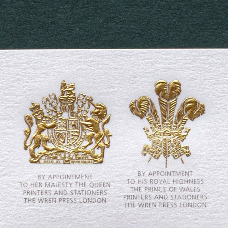 two gold die stamped royal crest logos printed in mayfair london by the wren press
