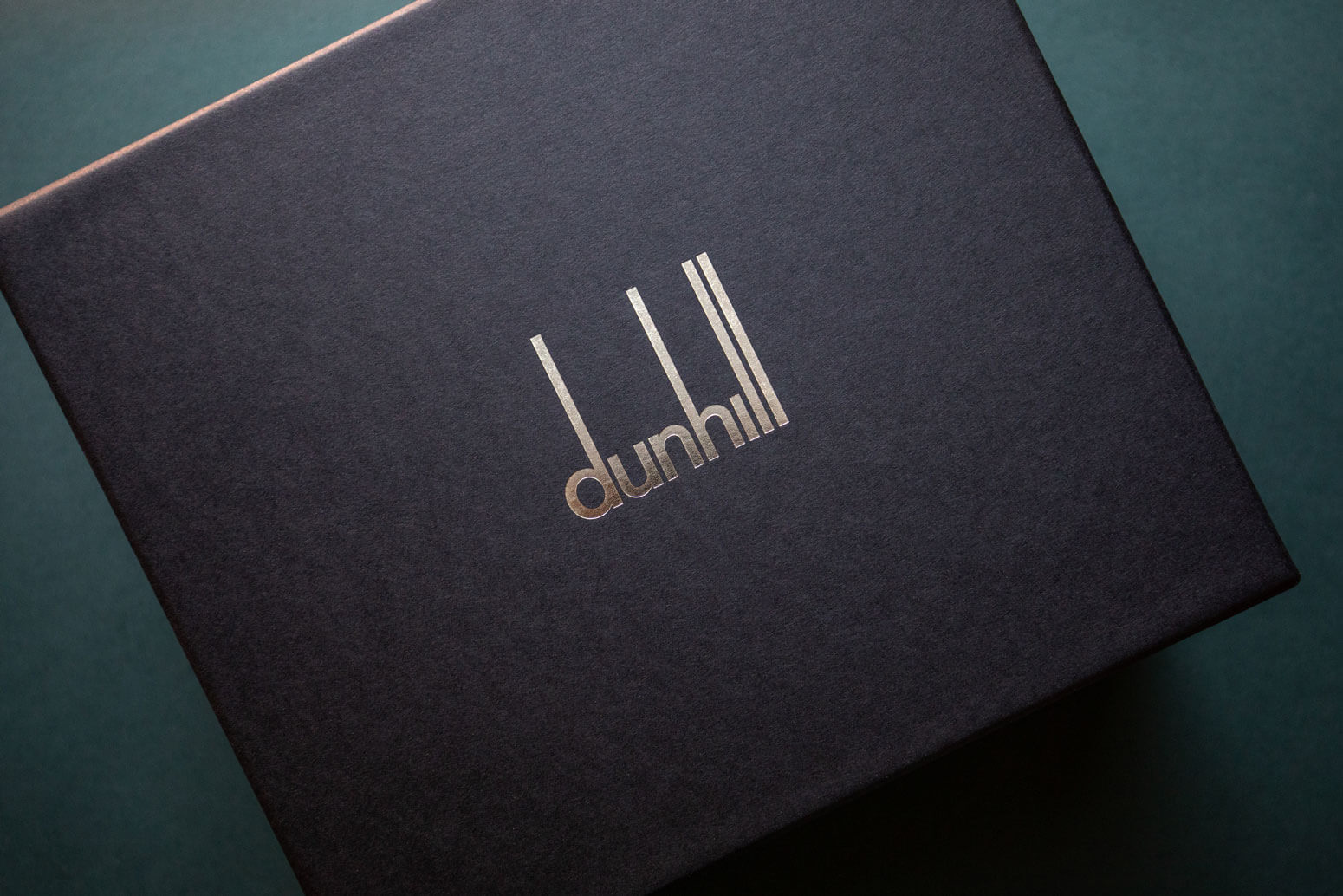 a bespoke black box with silver foiled stamped logo